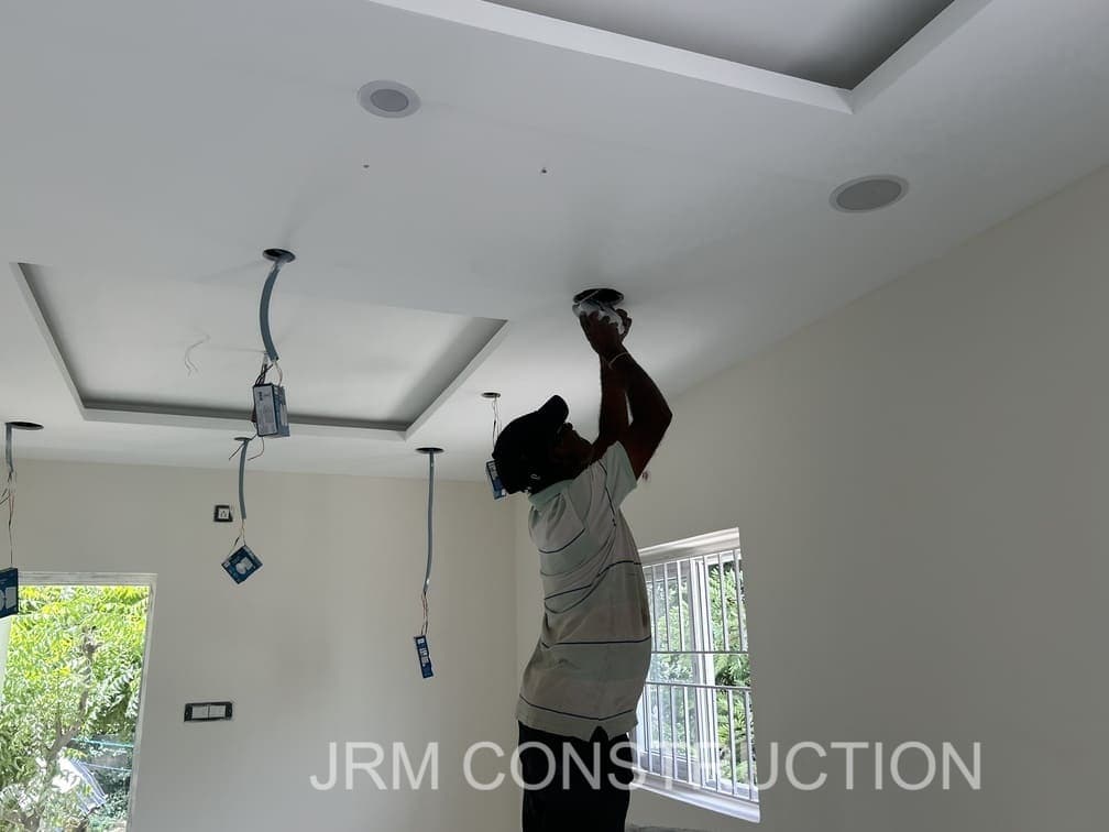Ceiling light fixing work in final electrical fitting stage..jpg