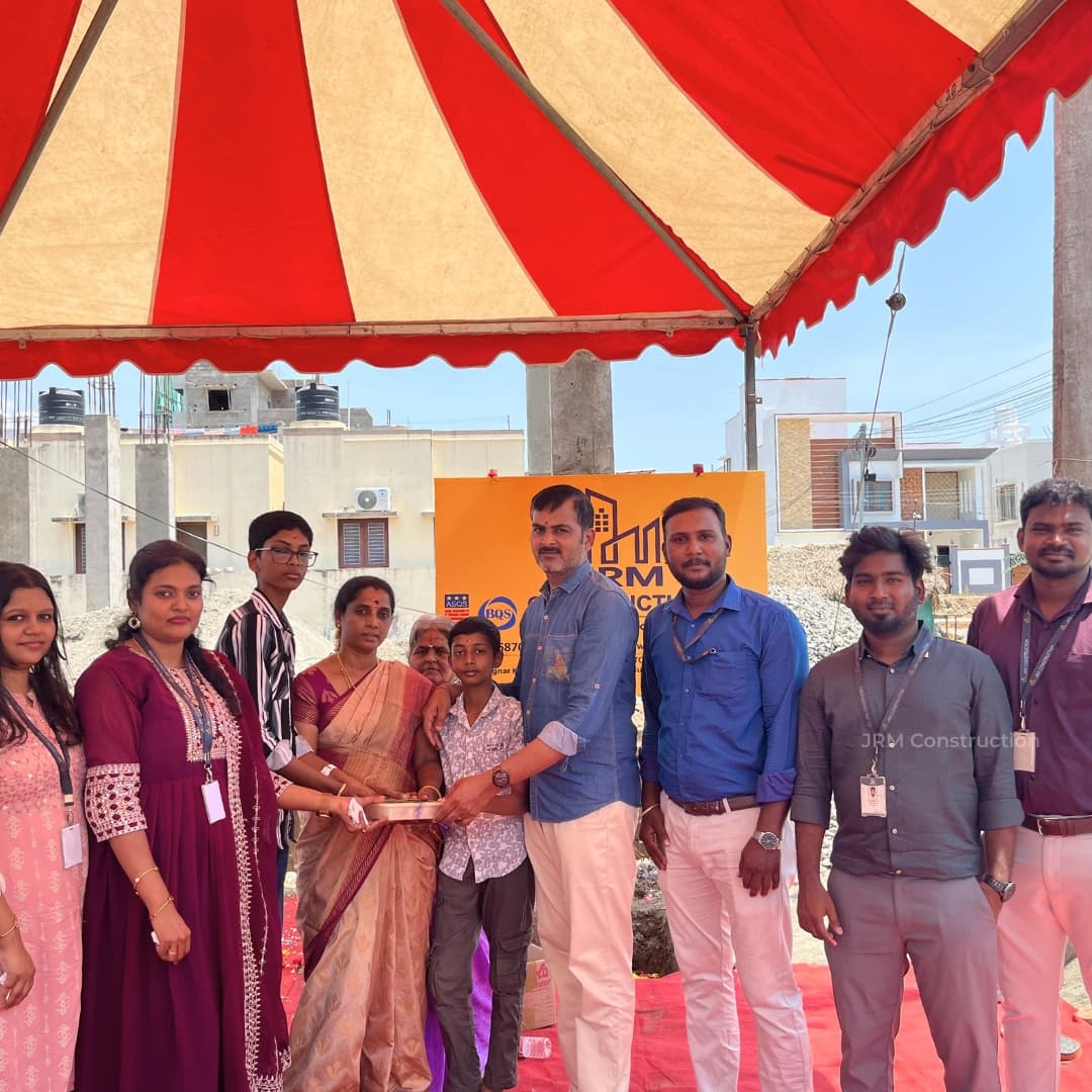 Mrs. Geetha and family with JRM Construction team.jpg