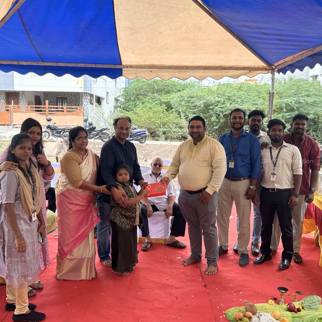 Mr. Mohan and family with JRM construction team on their bhoomi pooja.jpg