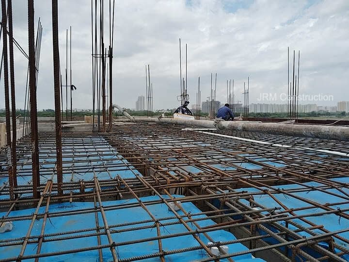Steel rods for columns and slab being installed as part of the foundation work.