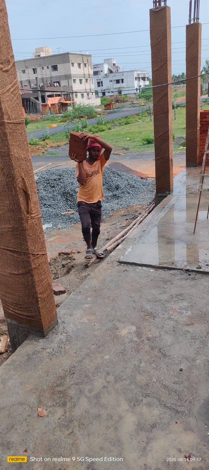 Worker carrying sand.jpg